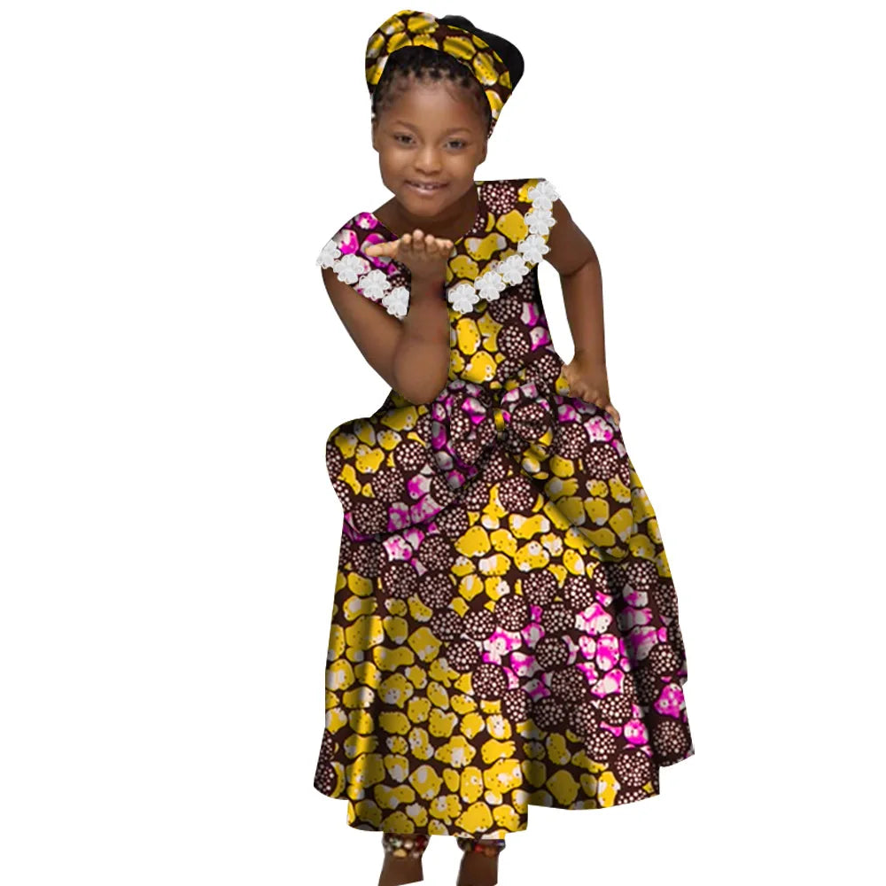 Girls African print mermaid dress by GuyaWax in cotton Bazin Riche Dashiki fabric, featuring vibrant, colorful traditional patterns.
