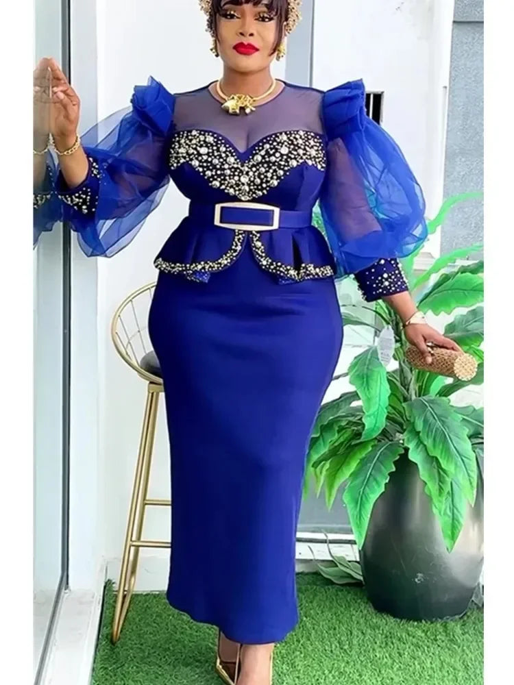 Elegant African women's dress featuring vibrant Ankara fabric, long dashiki style for wedding or party occasions.