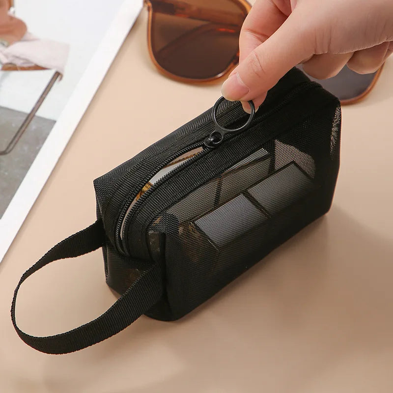Large black mesh travel cosmetic bag by Showlu Fashion Store, with multiple compartments for makeup and toiletries storage.