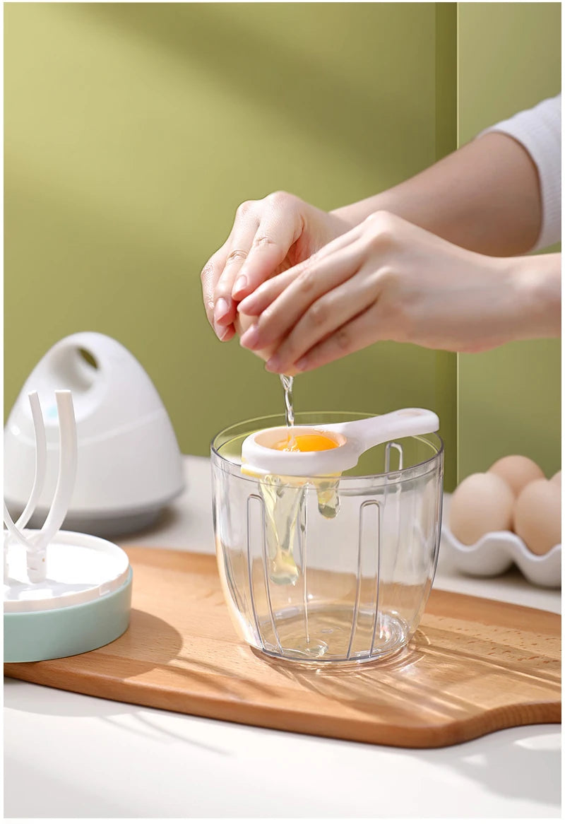 Showlu Smart General handheld USB electric egg beater with mini whisk for mixing cream and cake batter in the kitchen.