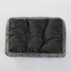A rectangular pet bed with a black, dotted waterproof base and a soft grey plush border.