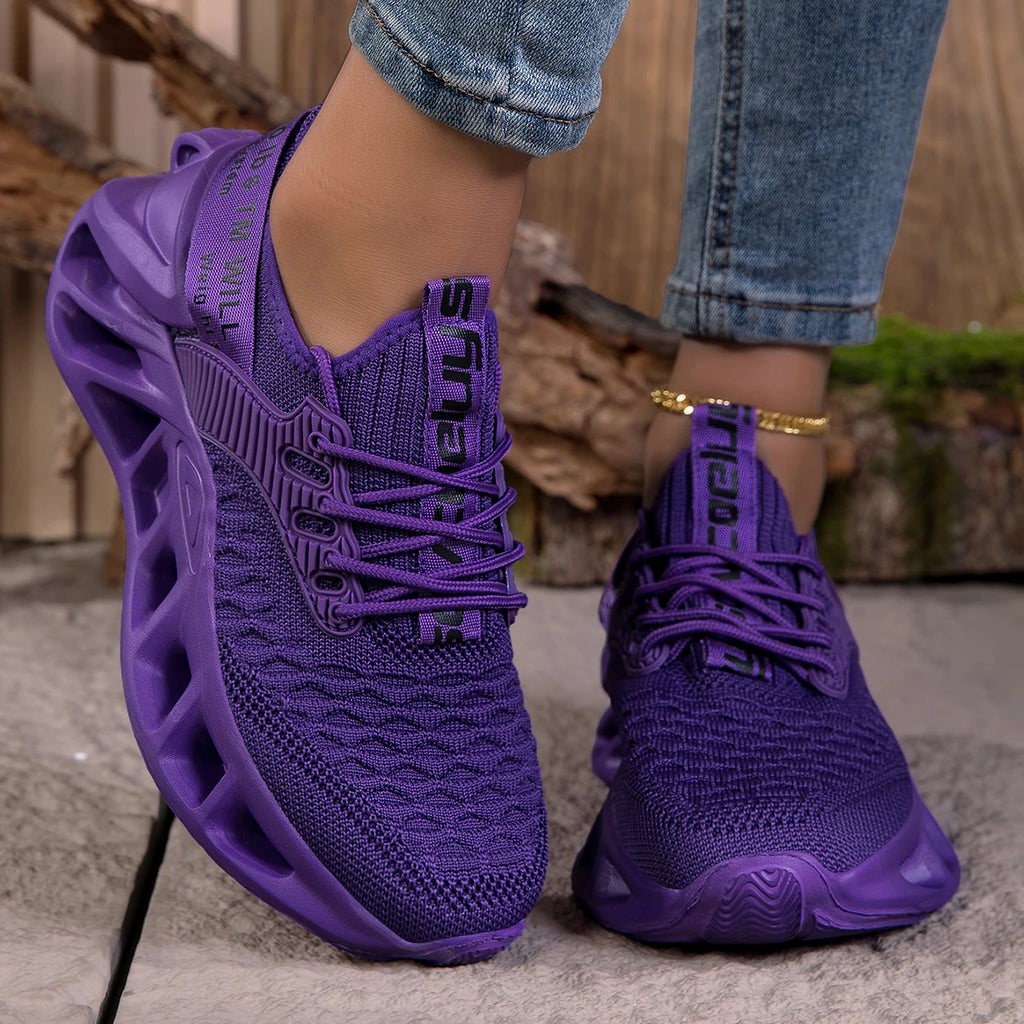 Purple women's sneakers with cushioned EVA soles, lightweight anti-slip running shoes featuring a stylish blade design.