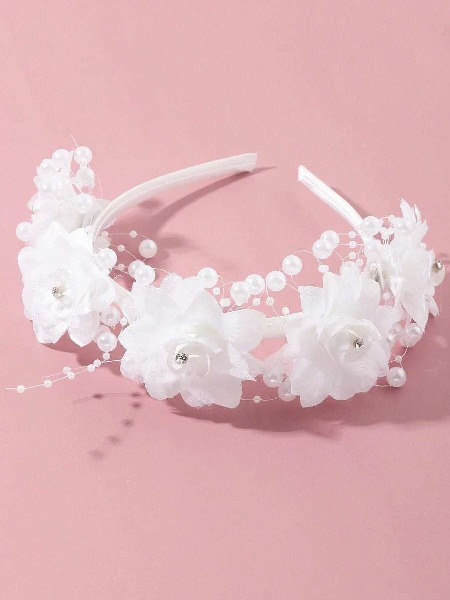White flower girl headband with elegant floral design, perfect for wedding bridal parties and special occasions.