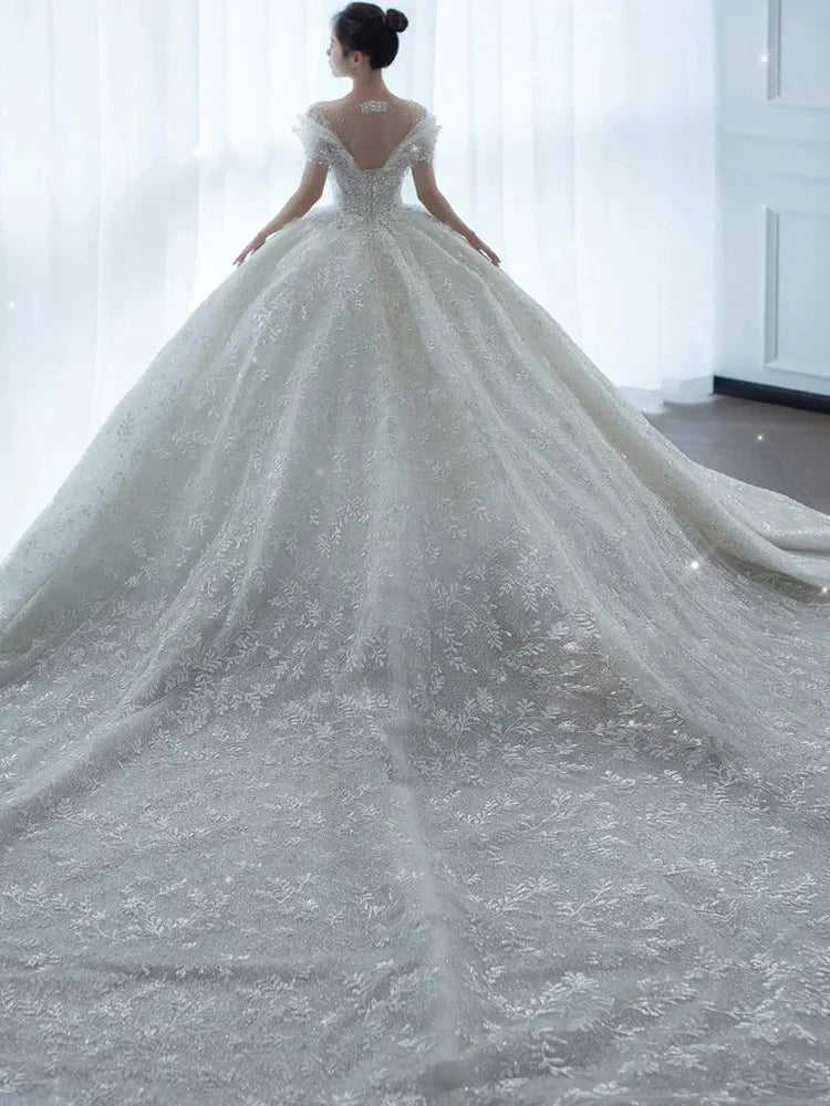 SHOWLU FASHION crystal beaded tulle ball gown wedding dress with intricate beaded details and flowing skirt, elegant bridal attire.