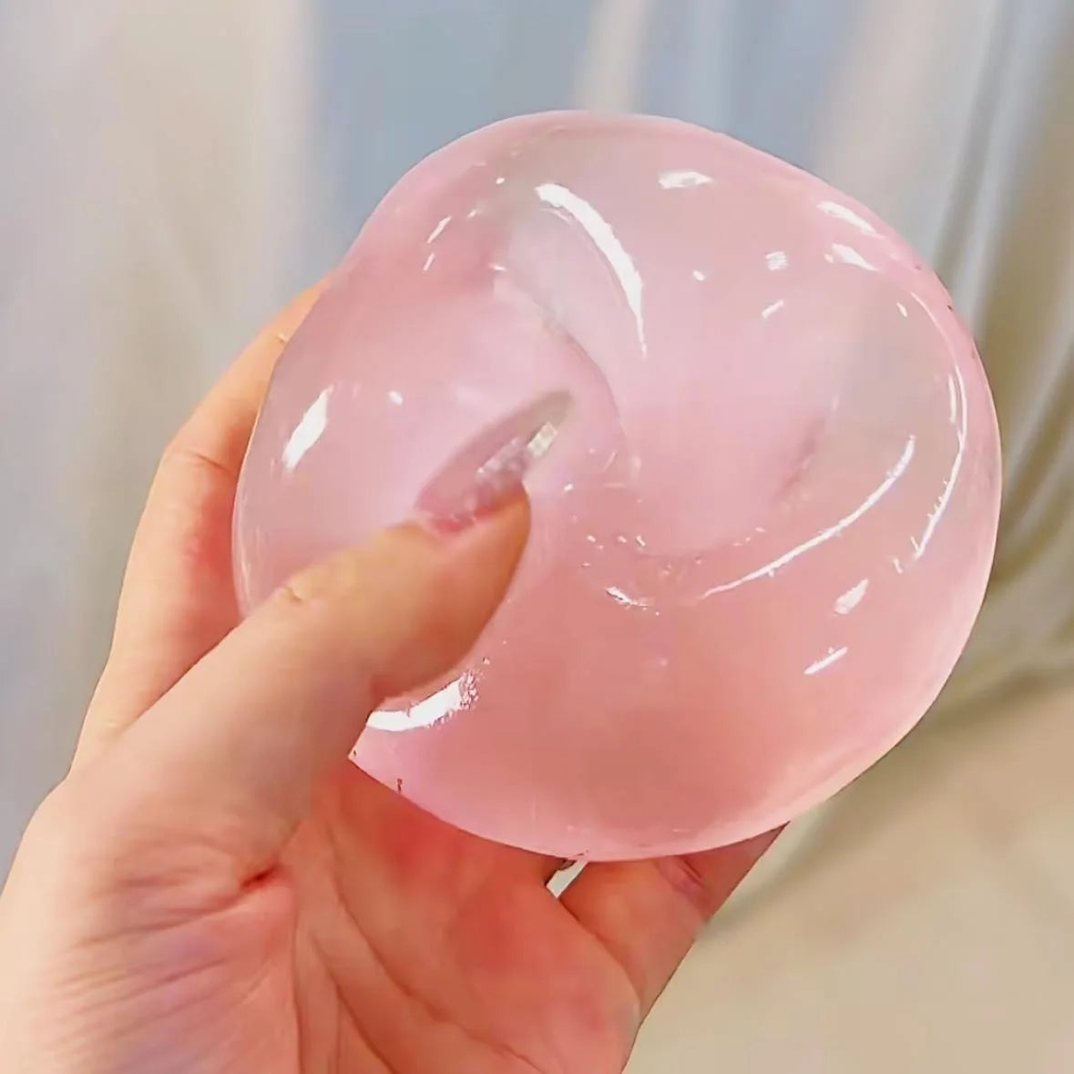 Transparent squishy maltose stress ball by Showlu Fashion Store, soft slow-rise sensory ball for hand exercise and stress relief.