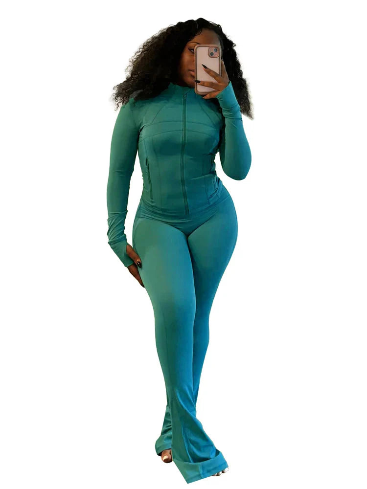 JENYAGE Women's two-piece tracksuit with flared pants and zip-up top, shown in stylish black for casual athletic wear.