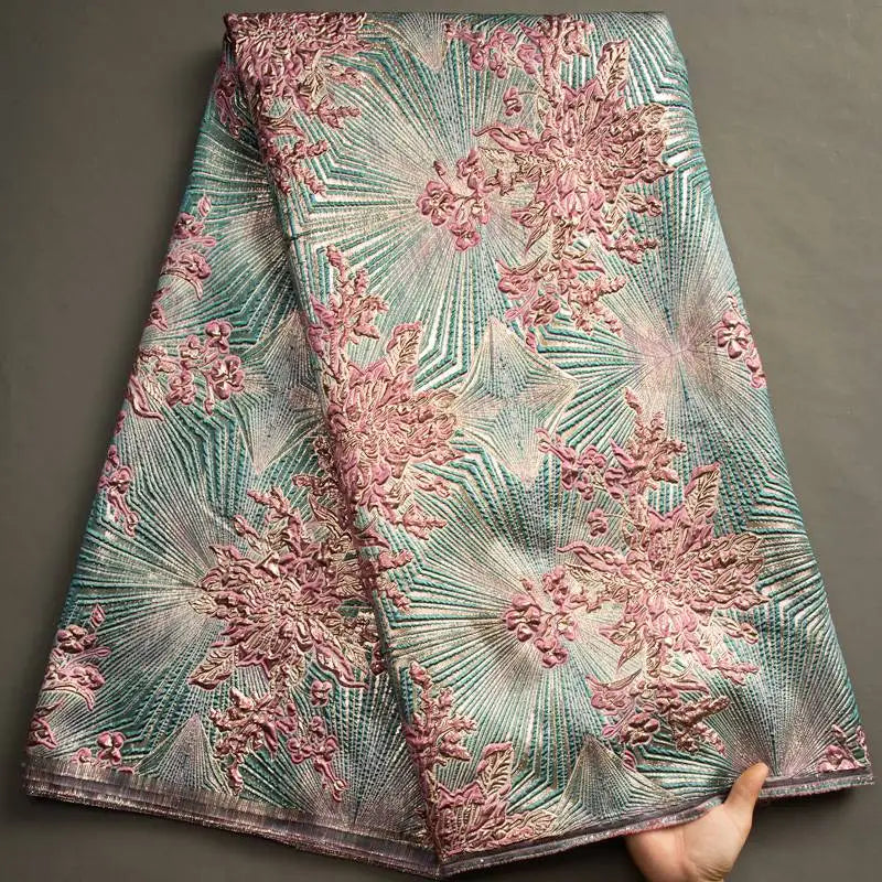 Nigerian Damask tulle fabric featuring floral brocade jacquard lace in vibrant colors, suitable for traditional and elegant garments