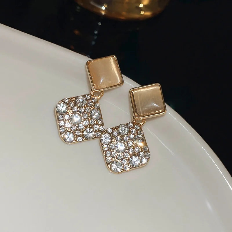 Showlu Fashion zircon cross stud earrings featuring geometric copper design, suitable for stylish, minimalist jewelry looks.
