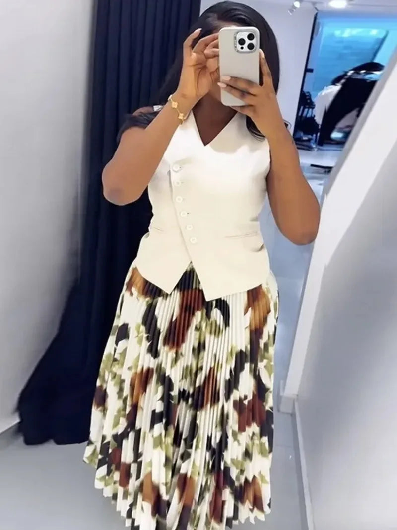 Two-piece African Dashiki wedding party suit with pleated skirt and matching tops, traditional Ankara outfit for women.