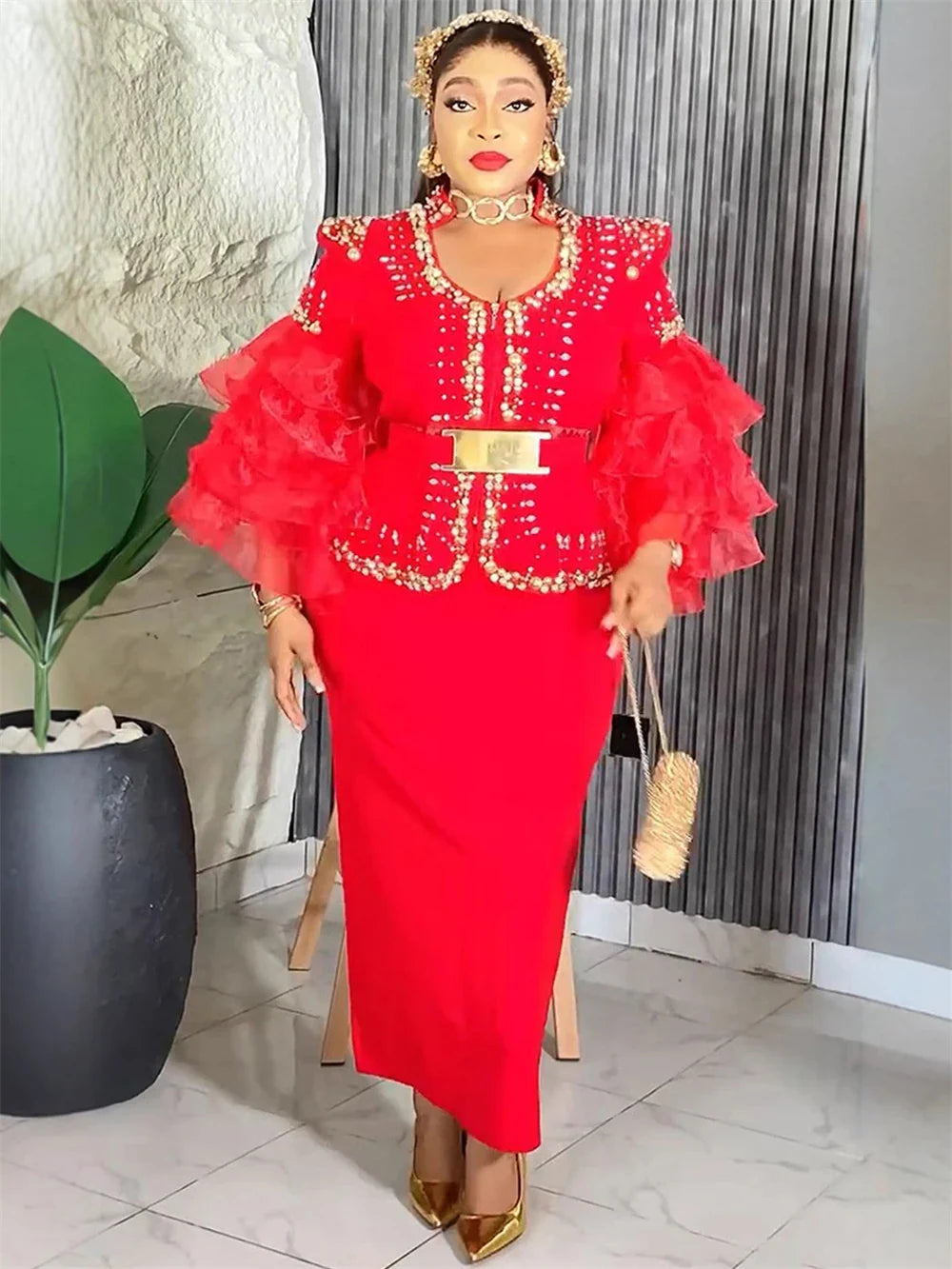 Elegant African beaded evening gown for women, vintage slim maxi dress with intricate beadwork and flowing fabric.