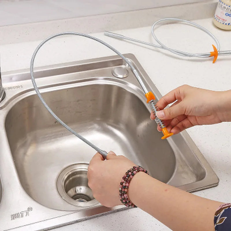 Showlu Smart General drain snake hair remover tool coiled for clearing clogged drains and removing hair blockages.