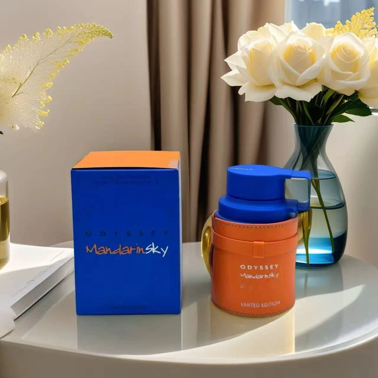 Unisex Armaf Odyssey Mandarin Sky Elixir perfume bottle with limited edition packaging, 3.4oz, showcasing a sleek, elegant design.