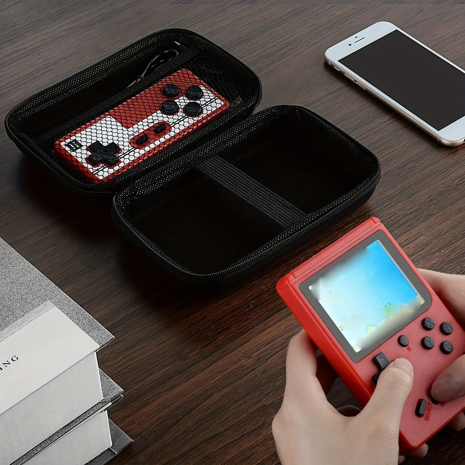 Showlu Fashion Store handheld game console carrying case with protective interior for travel, charging cable, earpods, and batteries.