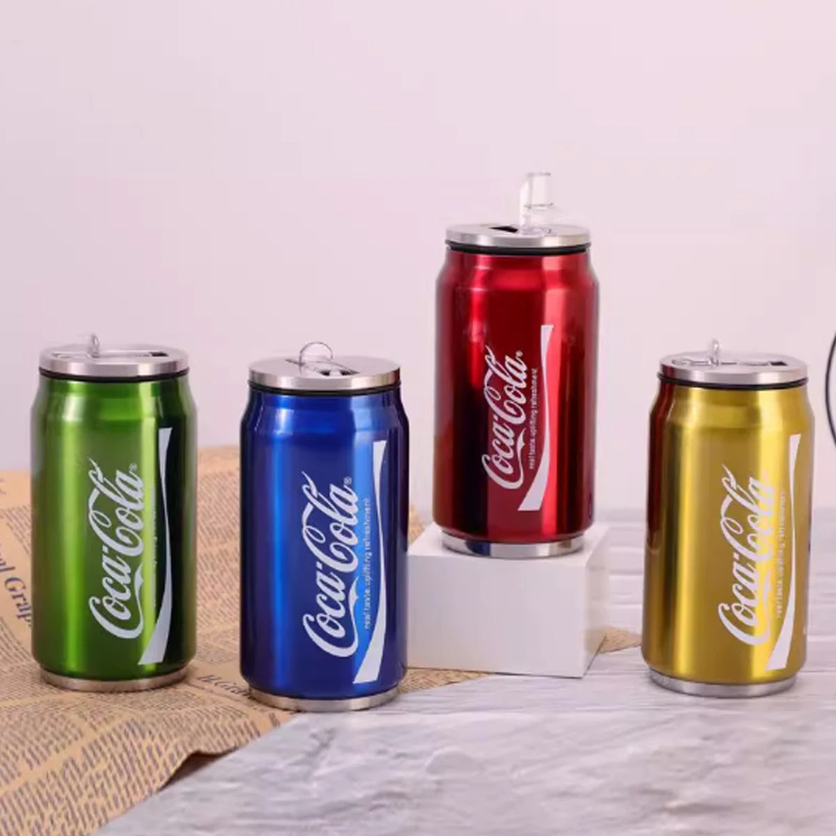Coca-Cola stainless steel mug by Showlu Fashion Store, insulated drinking cup with durable construction and red Coca-Cola logo.