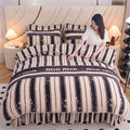 Thickened coral velvet bedding set with four-piece flannel quilt cover in soft, plush fabric, designed for cozy bedroom decor.