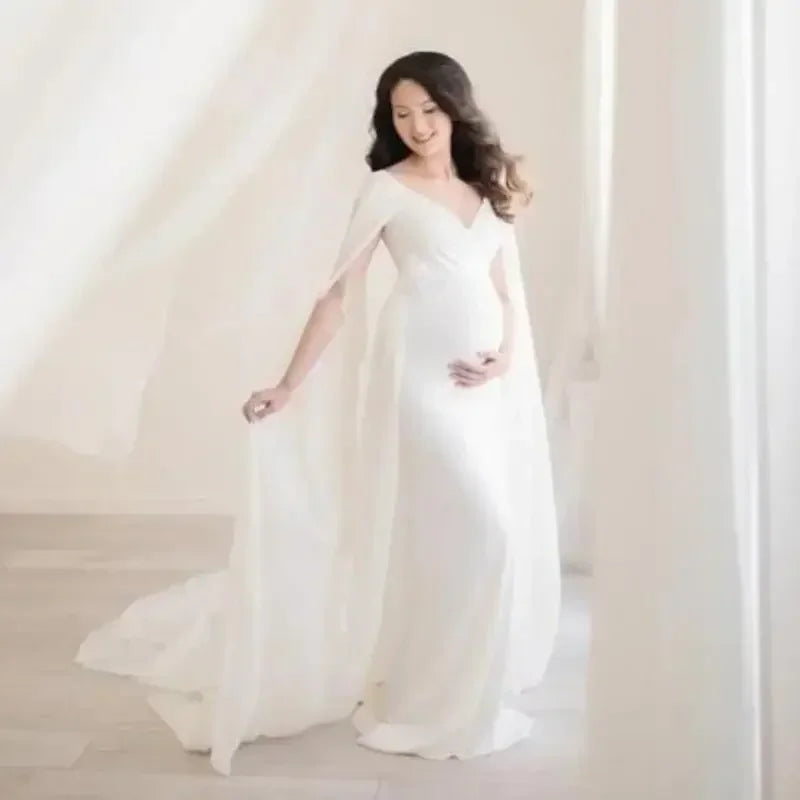 Off-shoulder maternity dress by Showlu Fashion, flowing maxi gown for pregnancy photo shoots, perfect for expectant mothers.