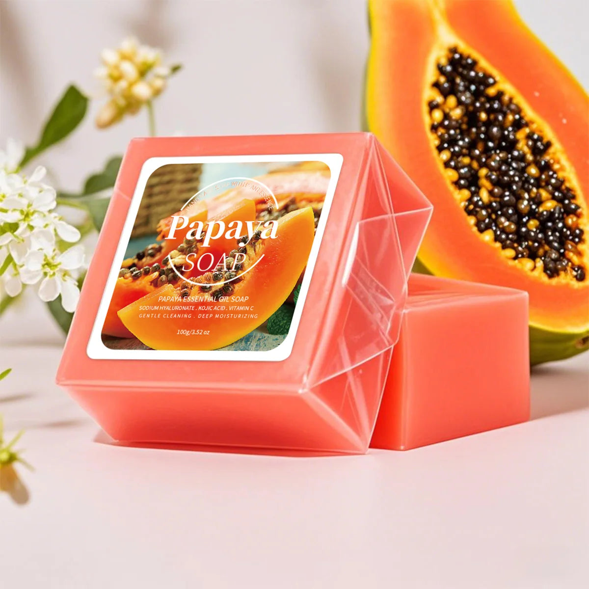 Handmade soap bar with papaya extract, coconut, and goat milk for deep cleansing and whitening, shown in a close-up image.