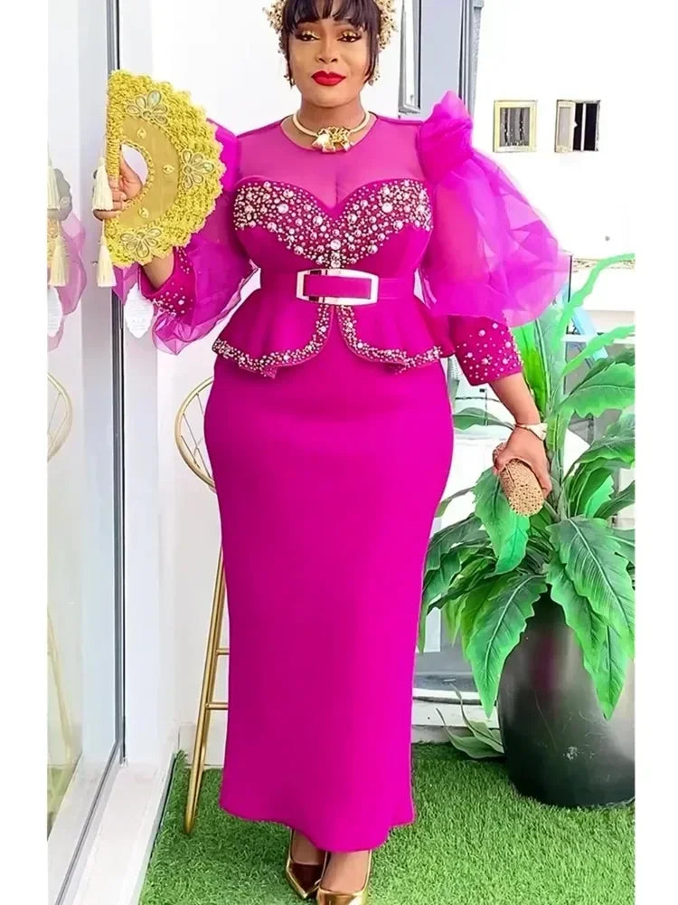 Elegant African women's long dress featuring Ankara fabric, plus size, suitable for wedding or party, by Showlu Fashion.
