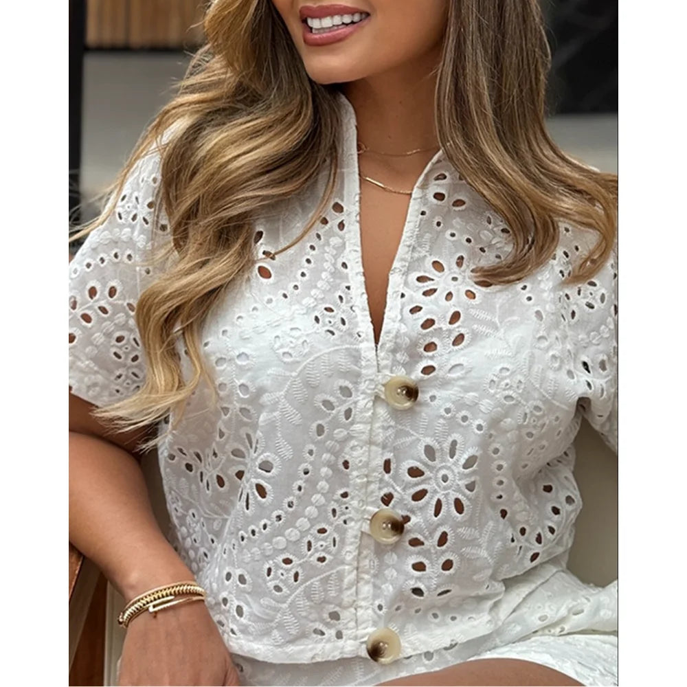 Women’s summer 2-piece outfit by Showlu Fashion, eyelet embroidery short sleeve top with stand collar and casual elastic waist shorts with pockets.