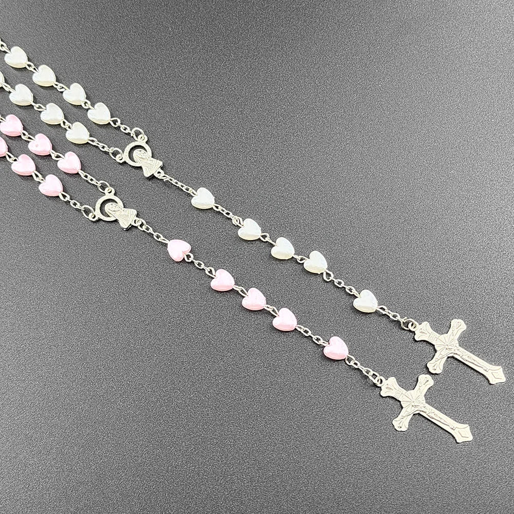 Pink heart Christian rosary beads necklace for women with Virgin Mary pendant, cross INRI, and prayer chain jewelry.