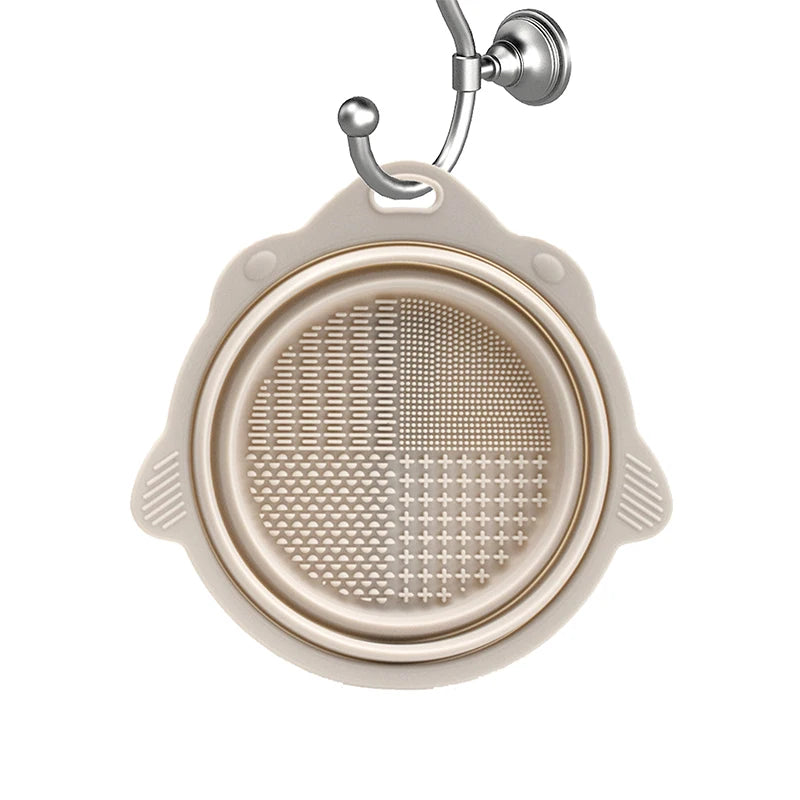 Silicone makeup brush cleaner pad by Showlu Smart General with textured surface for deep cleaning makeup brushes.