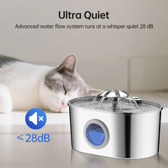 A stainless steel pet water fountain with a blue water level window sits beside a sleeping cat.