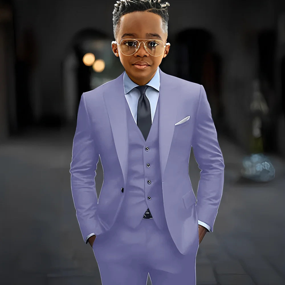 Dark grey boy's suit set including a slim fit 3-piece jacket, pants, and vest with peak lapel, high-quality and elegant for kids.