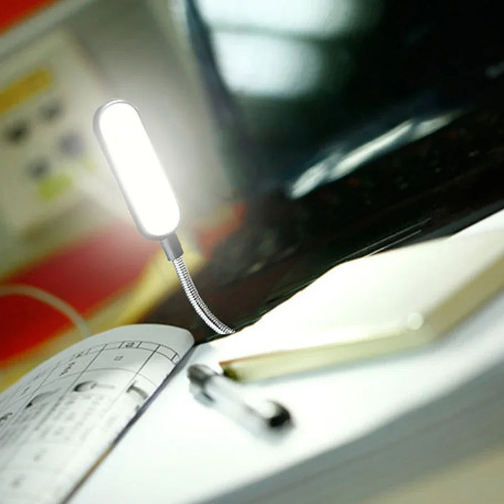 Showlu Smart General USB LED Light attached to a laptop, providing bright, energy-efficient illumination for workspace or travel use.