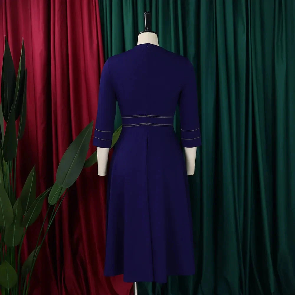 Naupang women's slim-fit A-line dress in solid color with three-quarter sleeves, stylish and elegant for casual or formal wear.