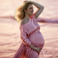 Showlu Maternity chiffon cape made of soft tulle, perfect for photo shoots, draped over a pregnant woman in a serene setting.