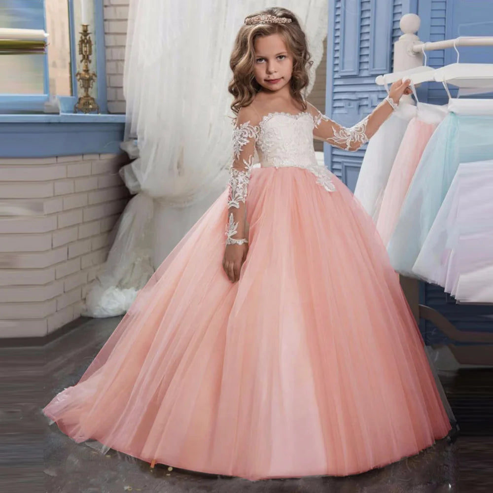 Light pink flower girl dress by Showlu Fashion with tulle, white appliques, long sleeves, for weddings, parties, or Holy Communion.