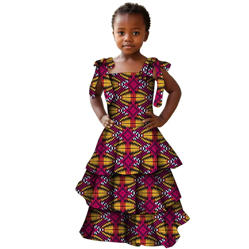 African print cotton girls' party dress in Bazin Riche style with vibrant colors and traditional patterns, perfect for special occasions.