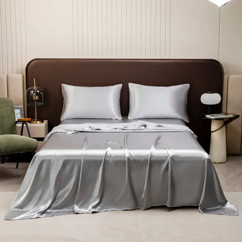SHOWLU Satin Silk Flat Bed Sheet in smooth polyester with a 500TC weave, shown in a close-up of the luxurious fabric texture.