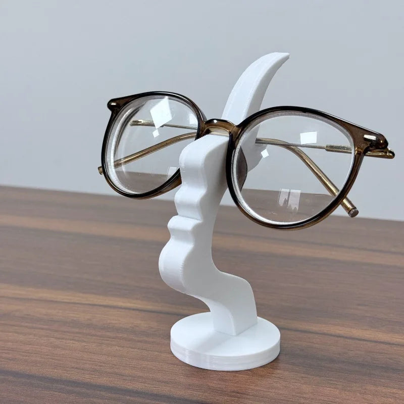 Minimalist human profile eyeglass holder stand by Showlu Fashion, 3D printed stand for organizing glasses in stylish home decor.