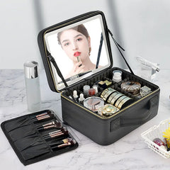 A black travel makeup case with an integrated LED mirror and adjustable interior compartments.