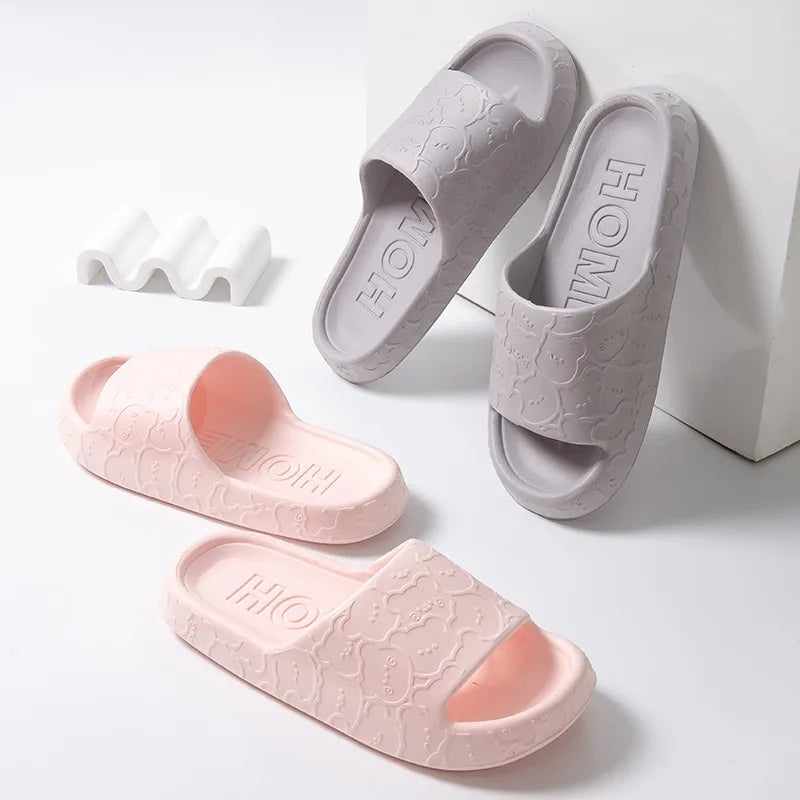 Cute women's cloud slip-on slippers with bear design, soft soles, non-slip EVA material, ideal for indoor, summer beach, and shower use.