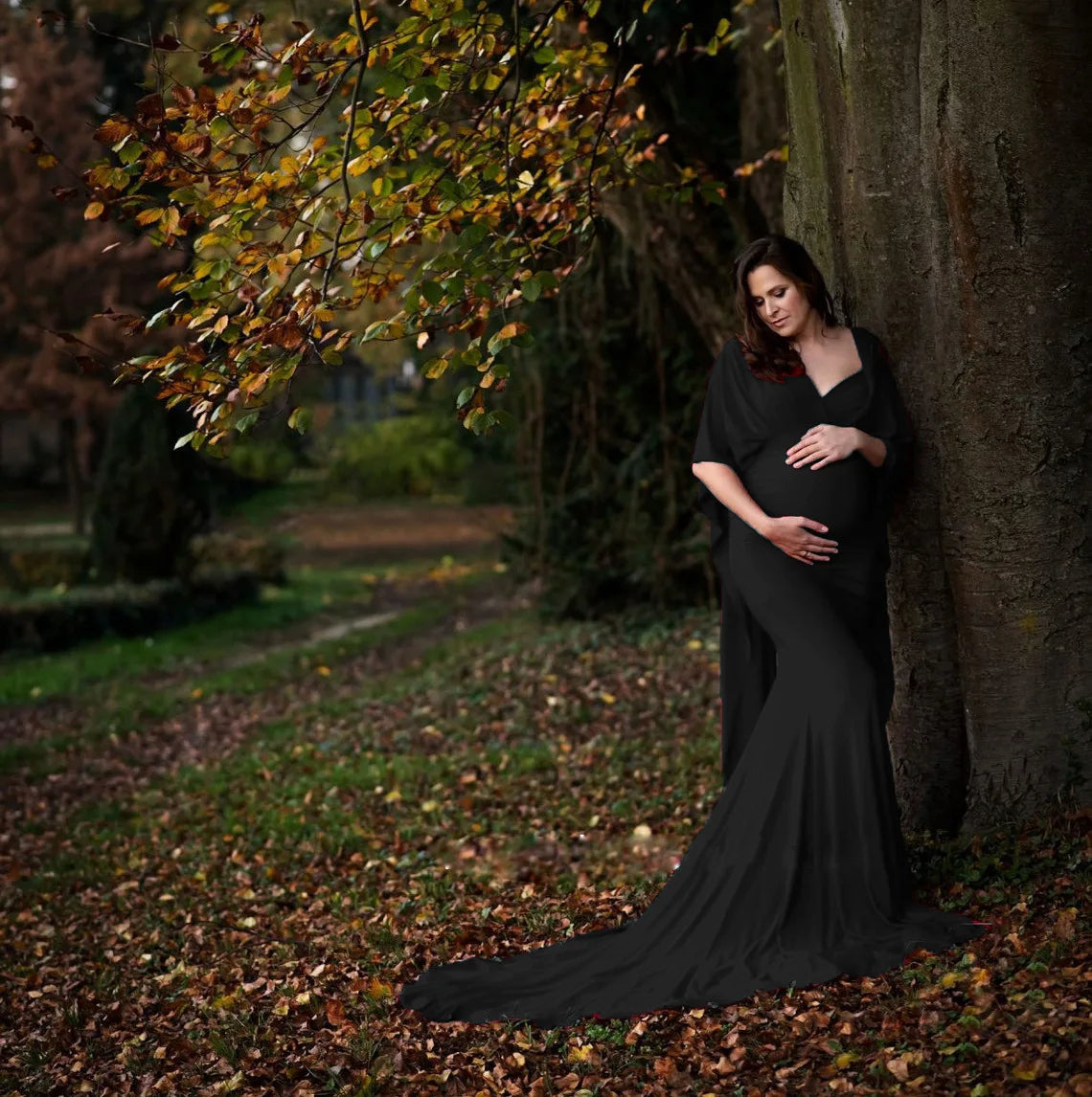 Elegant black batwing sleeve maternity maxi dress by SHOWLU FASHION STORE, ideal for photoshoots, flowing fabric and comfortable fit.