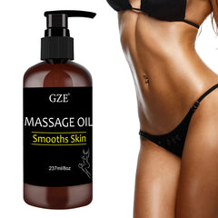 A brown pump bottle of GZE massage oil stands next to a woman's toned torso.