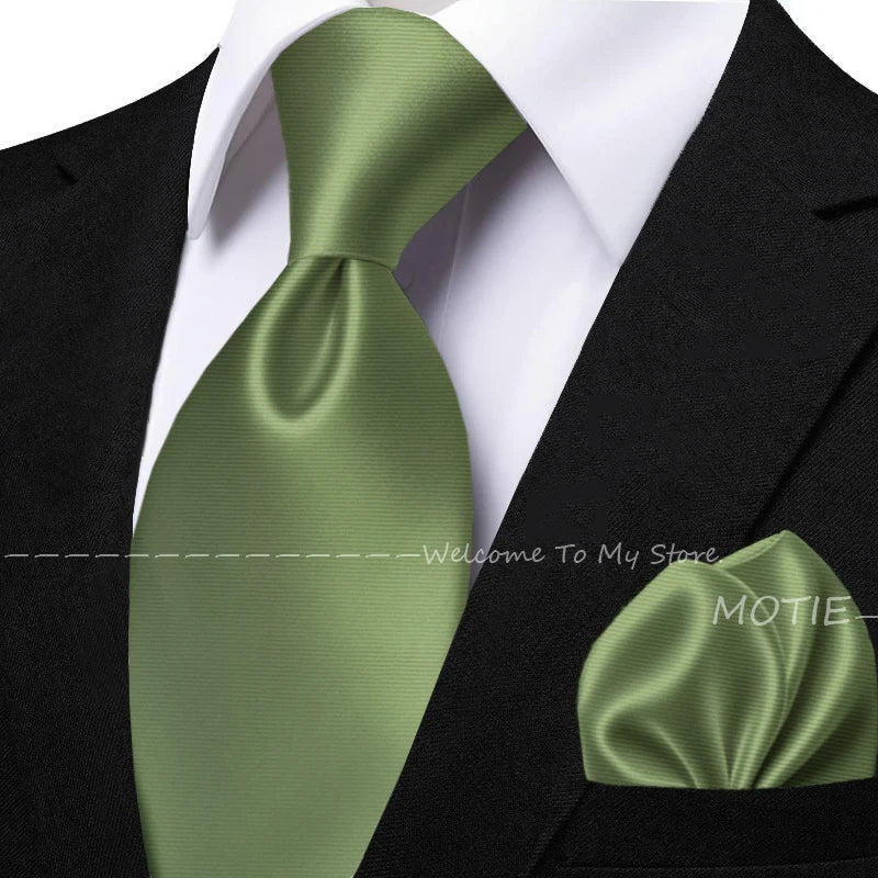 Men's solid sage green tie set with matching pocket square, flower brooch, cufflinks, and collar accessory for wedding or daily wear.
