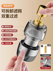 A disassembled kitchen faucet aerator with a gold connector, transparent housing, and a stainless steel filter mesh.