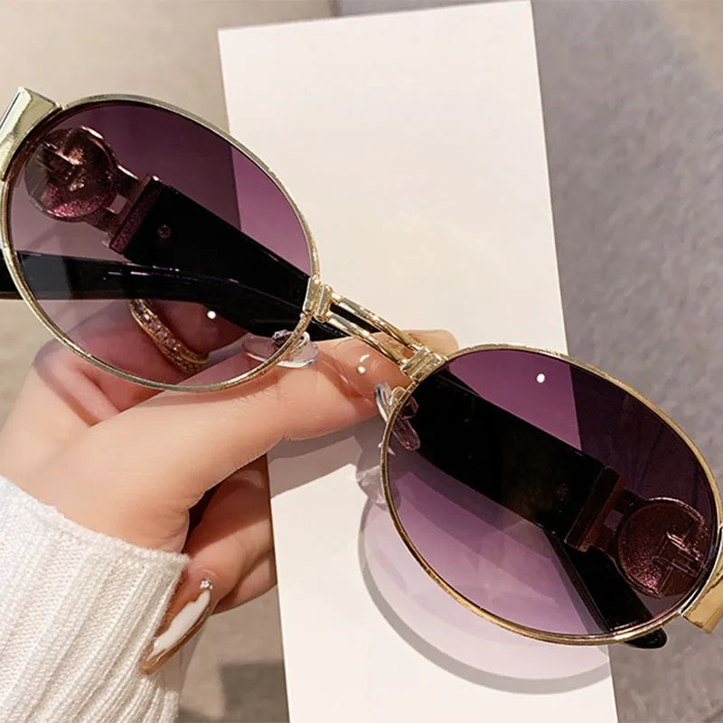 Unisex UV400 fashion oval frame sunglasses with polarized mirrored lenses, offering stylish eye protection.
