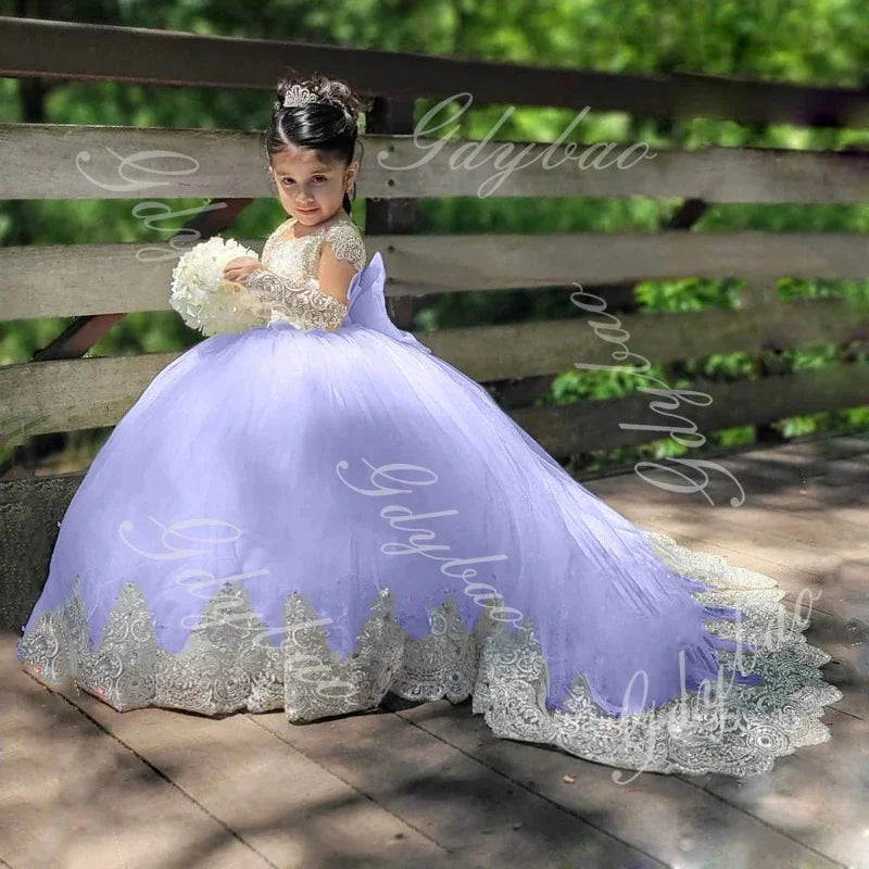 Customized ivory flower girl dress with appliques, floor-length gown for wedding, birthday, or communion, shown with intricate details.
