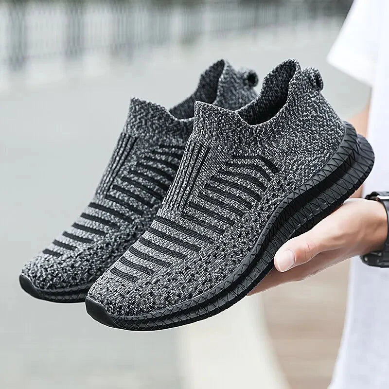 SHOWLU men's breathable mesh slip-on walking shoes with cushioned soles and lightweight design for running and everyday wear.