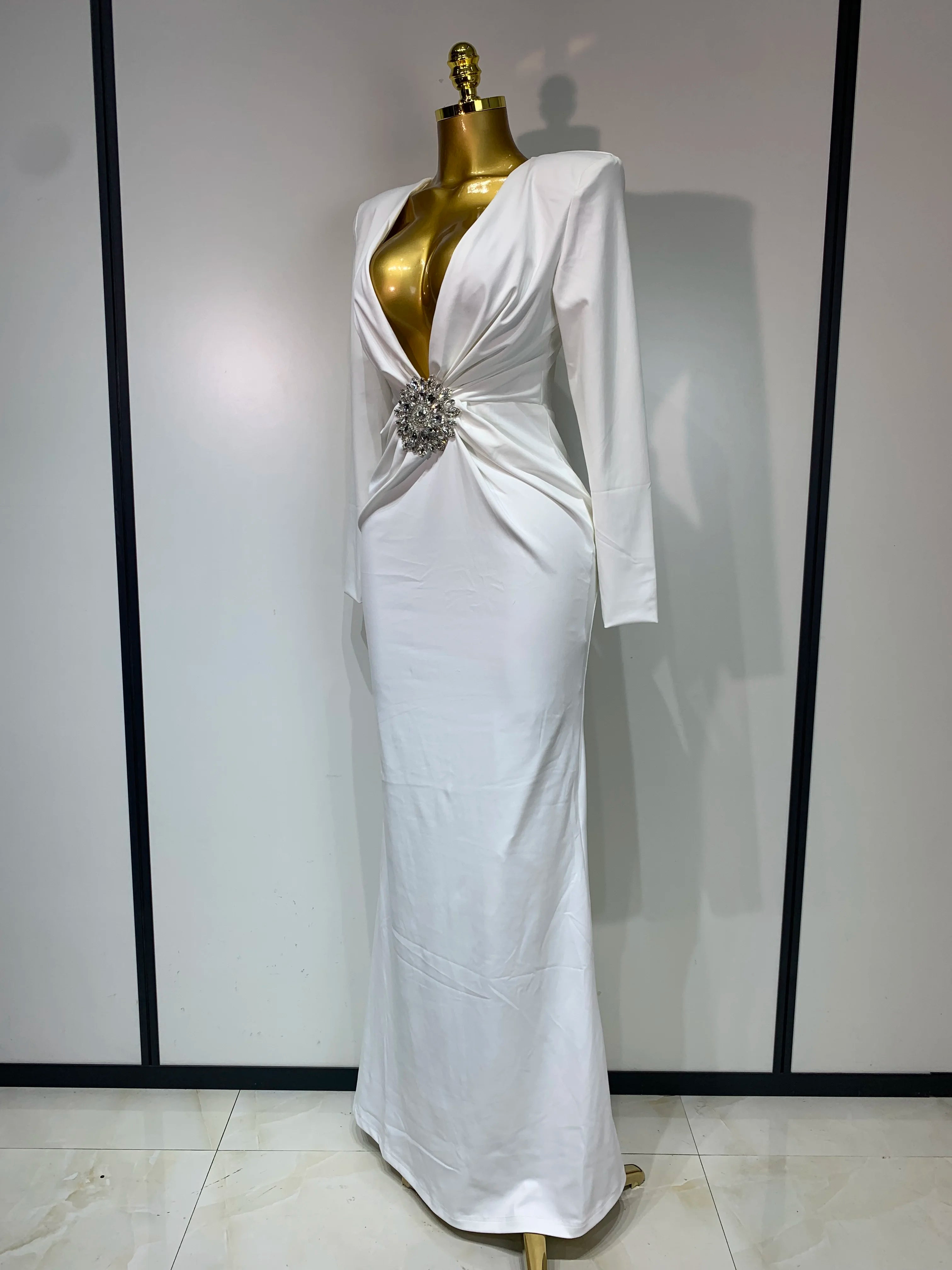 Women’s long sleeve deep V-neck bodycon evening dress by Showlu Fashion, elegant black party and cocktail dress with a fitted silhouette.