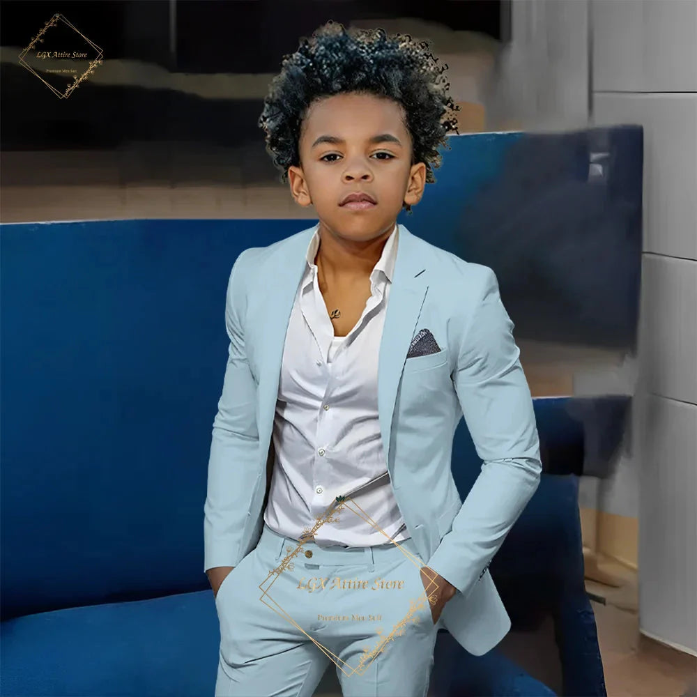 Boy wearing SHOWLU FASHION STORE orange slim fit 2-piece suit with single-breasted twill jacket and matching pants.