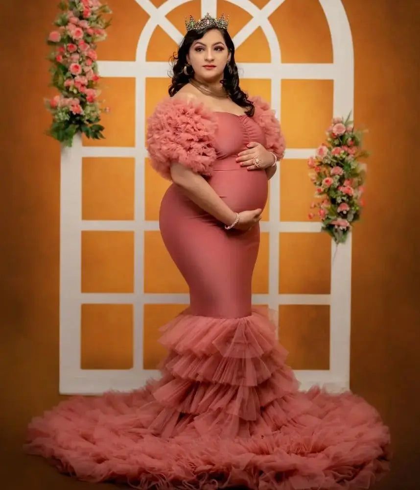 Pink off-shoulder maternity robe with tiered ruffles and mermaid style, perfect for pregnancy photos and baby showers.