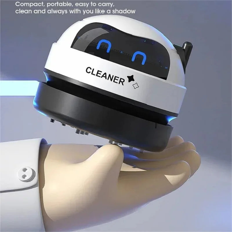 Mini USB Robot Desk Vacuum by Showlu Smart General, compact black robot with suction nozzle cleaning dust from a desk surface.