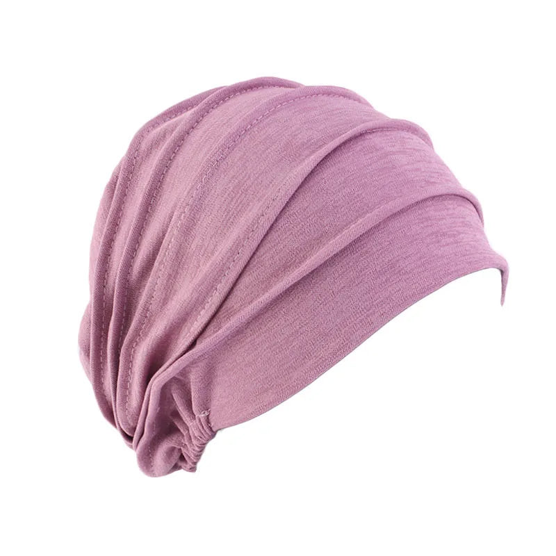 Women’s solid color turban cancer beanie by Showlu Fashion Store, elastic head cap with inner hijab for hair loss and chemo needs.