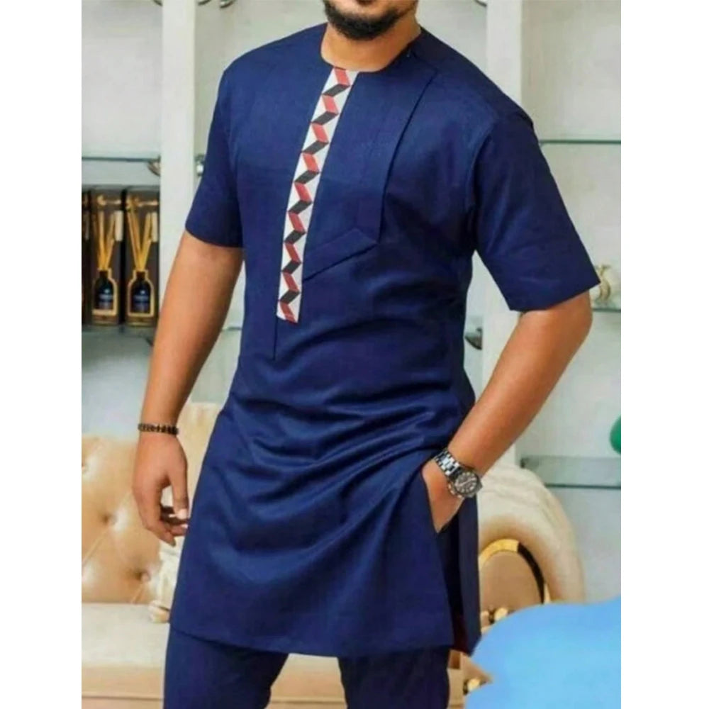 White Showlu men's Kaunda suit, traditional African 2-piece cotton set, featuring intricate embroidery and classic style.