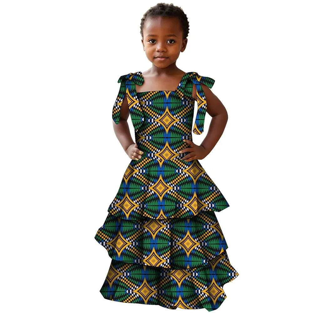 Girls African print cotton party dress in Bazin Riche style featuring vibrant colorful patterns and traditional design details.